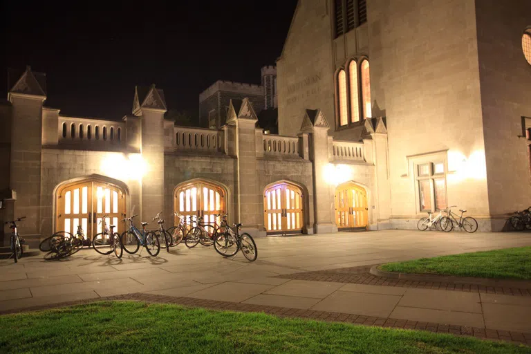 Whitman illuminated by lamp light at night