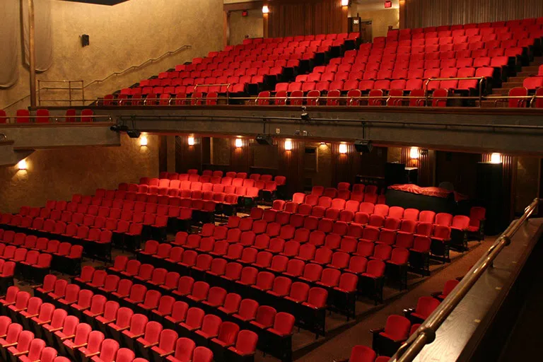 Rows of red seats inside McCarter 