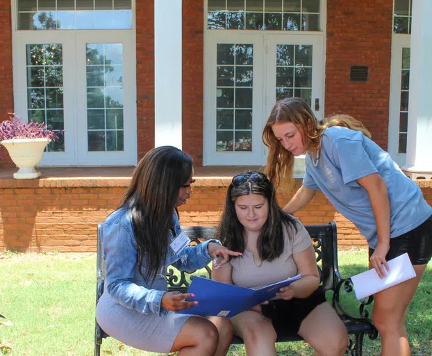 Students gather on the patio on the front side of Turner Dining Hall.