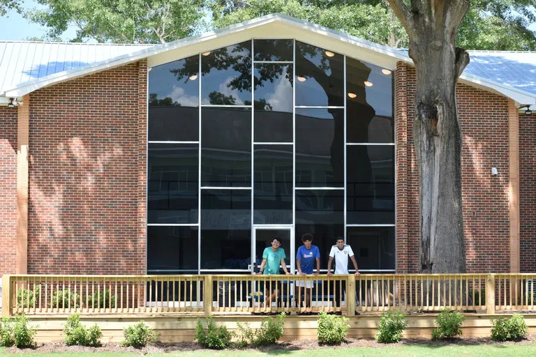 A few students talking outside Mitchell Hall