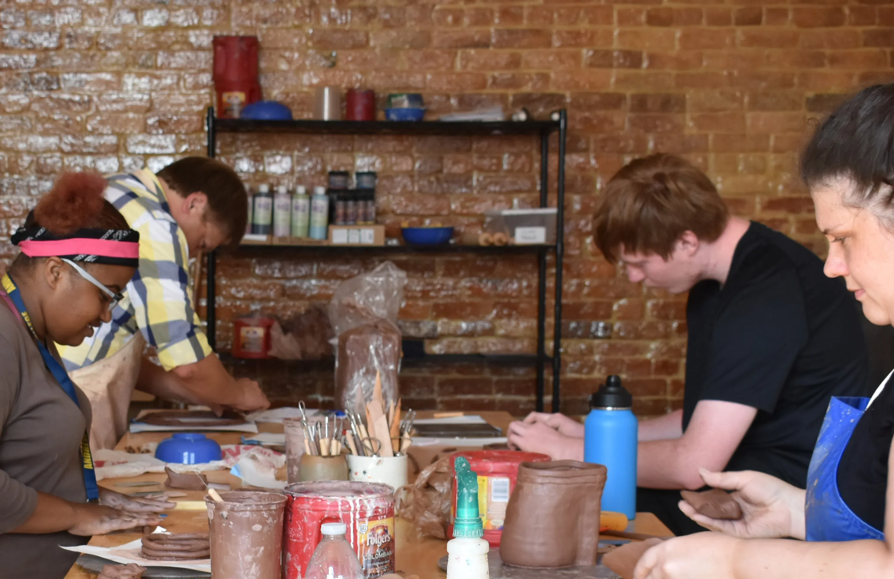 Students working on their current ceramics in class.