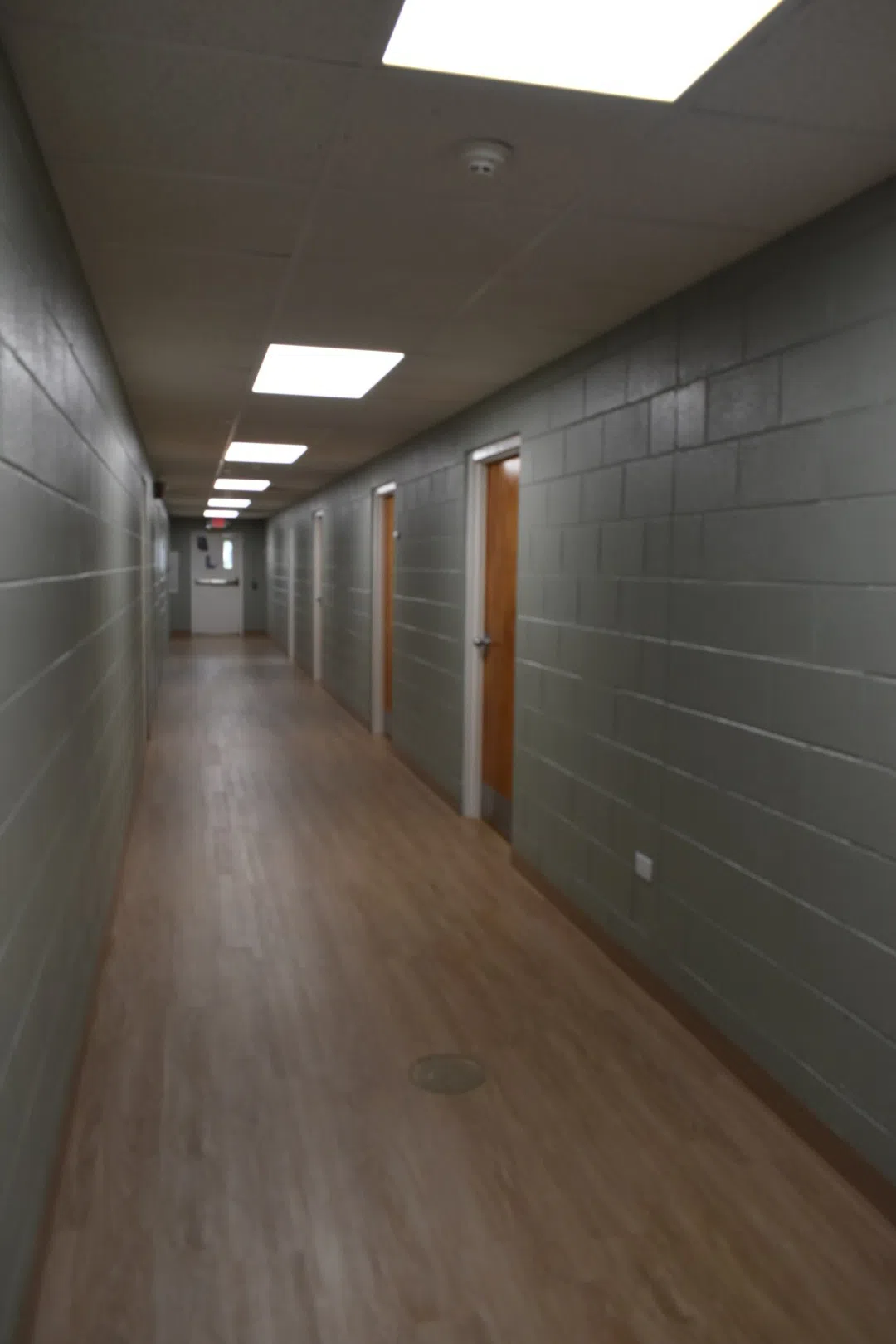 Hallway with doors located in Rhodes Residence Hall.