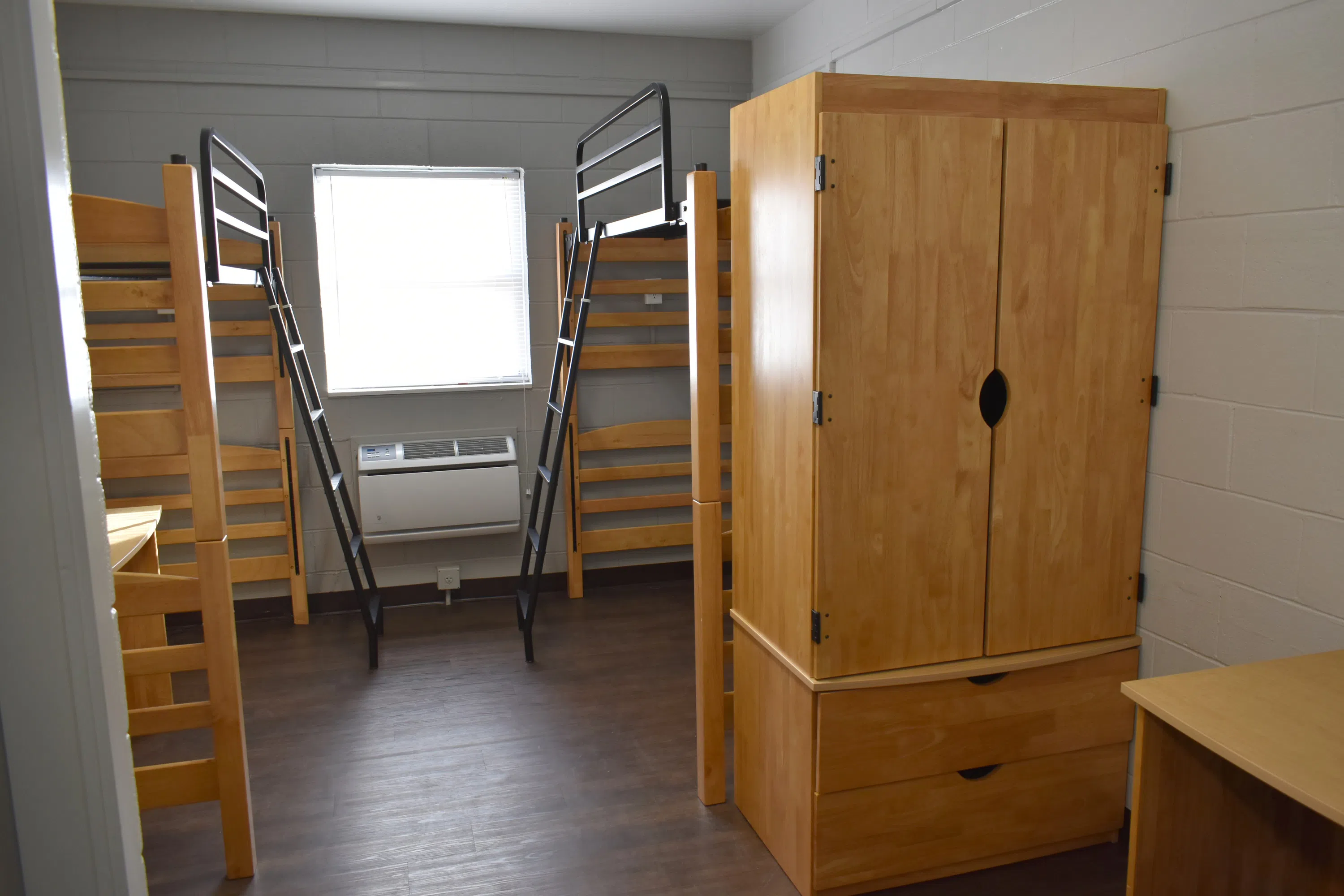 Inside Mitchell Hall with beds and furniture