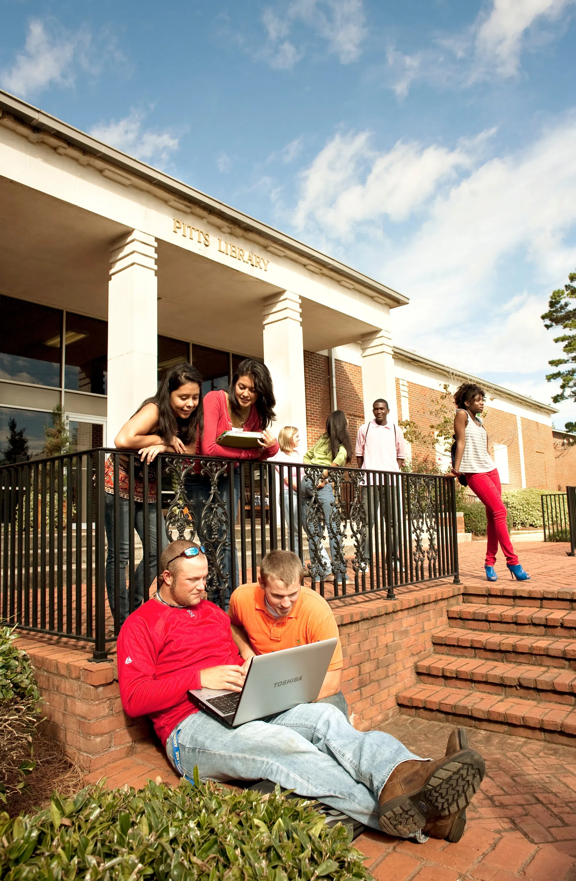 College students gathered on the front steps of Pitts Library.