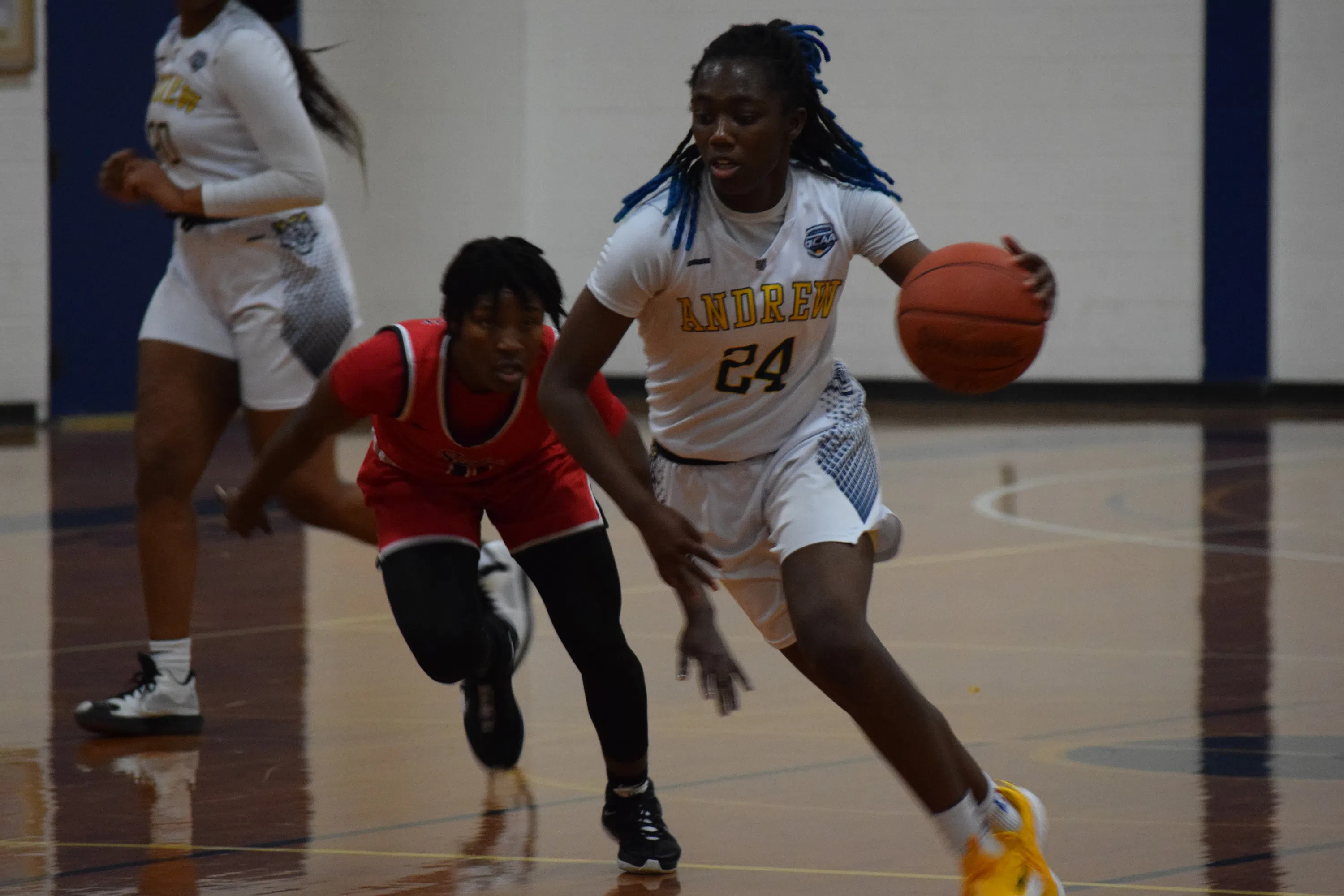 Andrew College basketball player Taliyah Wesley drives to the basket against an opponent in Jinks Gymnasium.