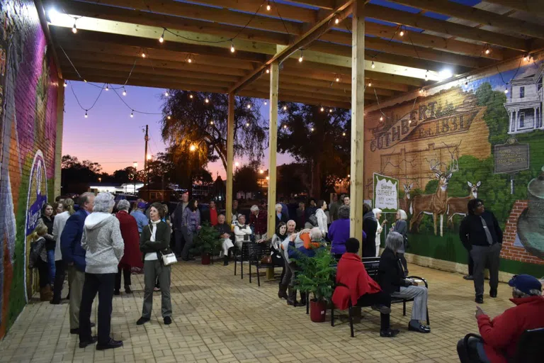 People gathered in downtown Cuthbert, GA to dedicate the area known as Magnolia Alley that features beautiful murals.