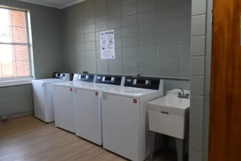 Laundry Area and sink located in the Rhodes Men's Residence Hall.