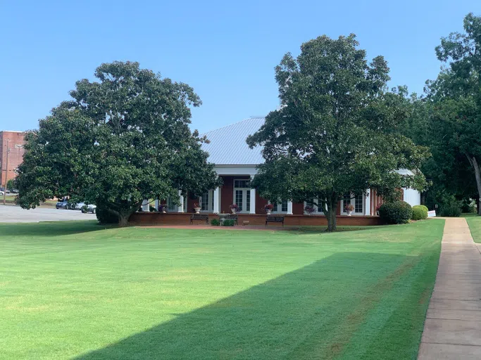 Exterior image of outside of the Turner Dining Hall with trees and lawn on the campus of Andrew College in Cuthbert, GA.