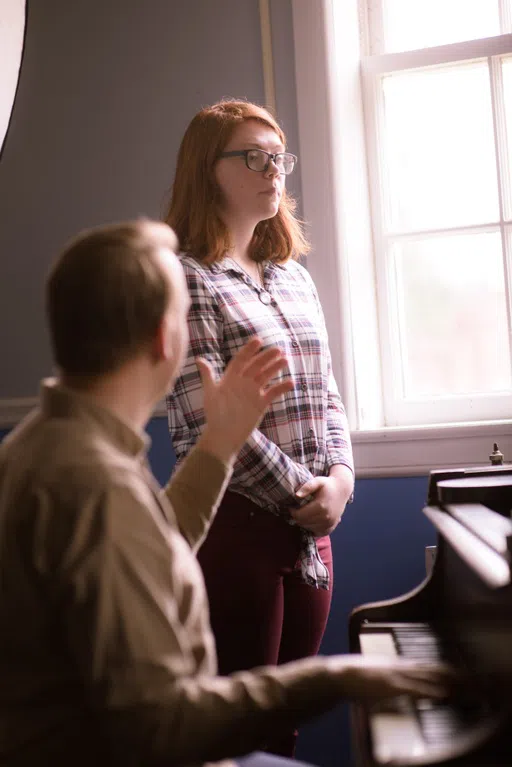 Voice student and Professor Kolan in Suarez Music Building in lesson.