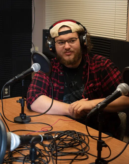 Students in the newly added podcast studio located inside Pitts Library.