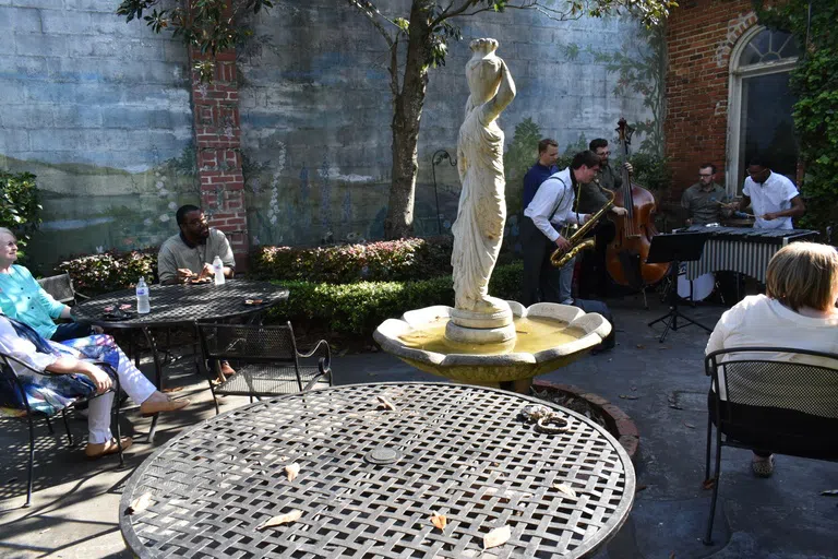 Jazz musician students entertain guests playing music in the Goodman Courtyard.