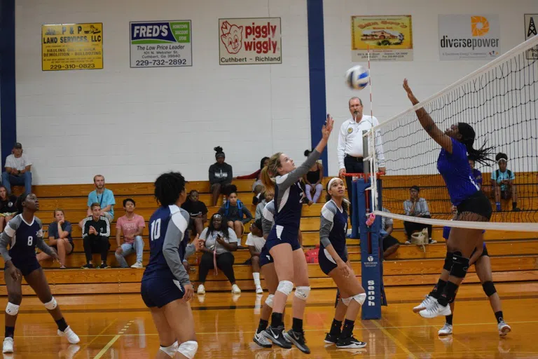 Volleyball and basketball athletes play their home games inside Jinks Gymnasium with spectators.