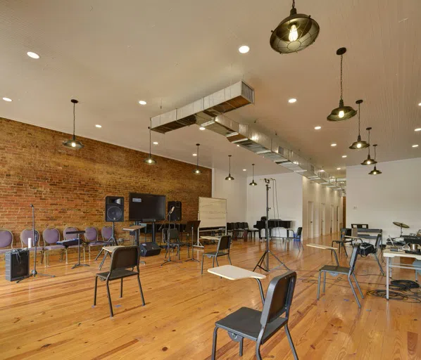 Image of music room chairs, whiteboard, and other equipment inside the Richard B. Taylor open area room on the campus of Andrew College located on the square in downtown Cuthbert, GA.