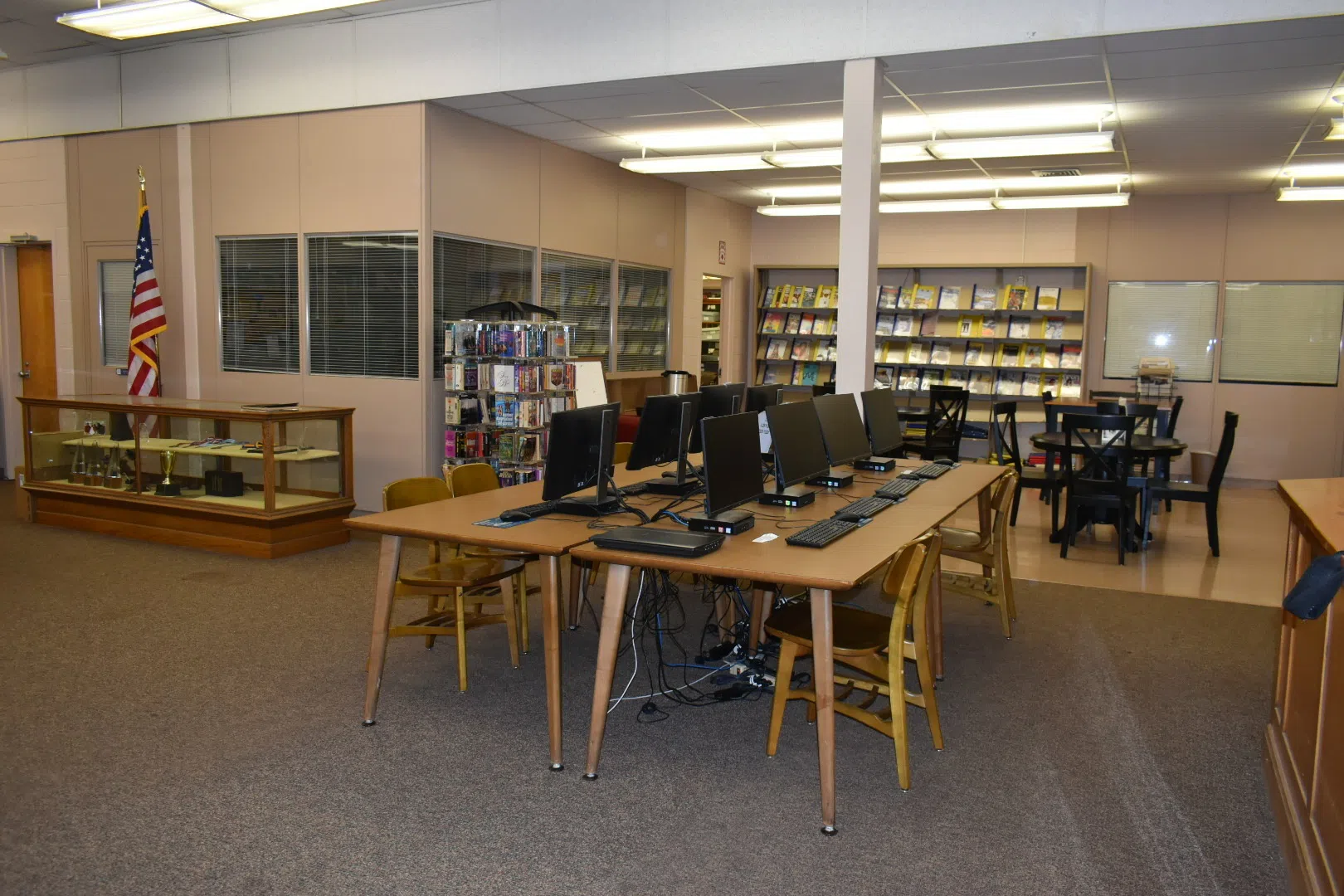 Offices, tables, print materials, desk, chairs and computers in the Pitts LIbrary.