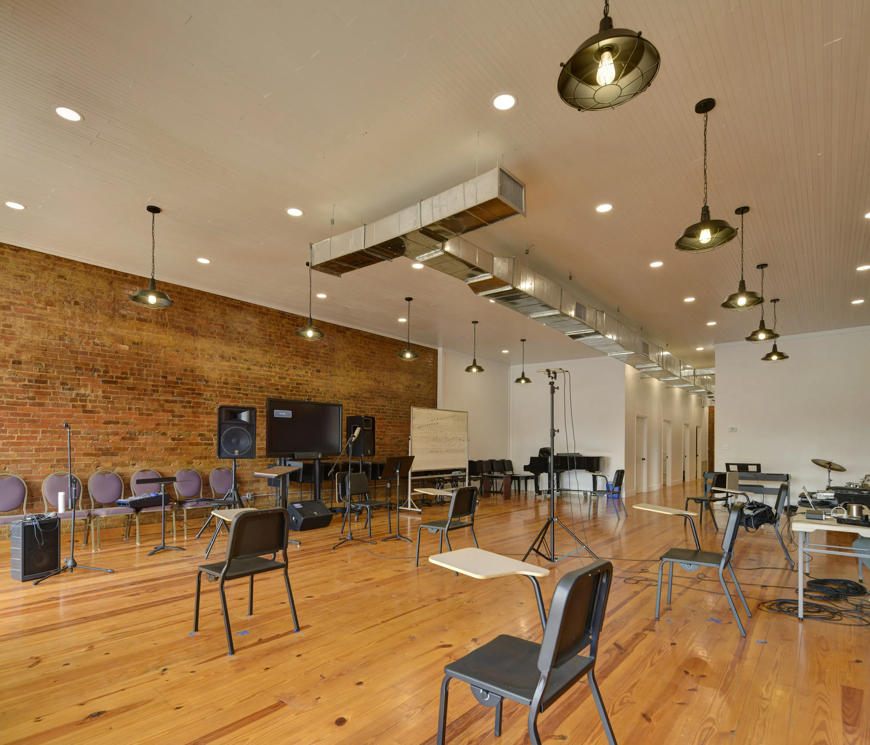 Image of music room chairs, whiteboard, and other equipment inside the Richard B. Taylor open area room on the campus of Andrew College located on the square in downtown Cuthbert, GA.