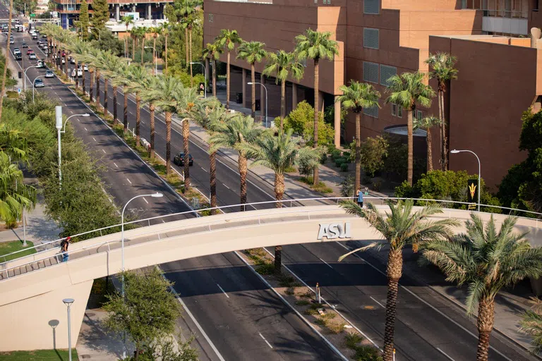 Pedestrian overpass for students to cross over four-lane University Drive. 