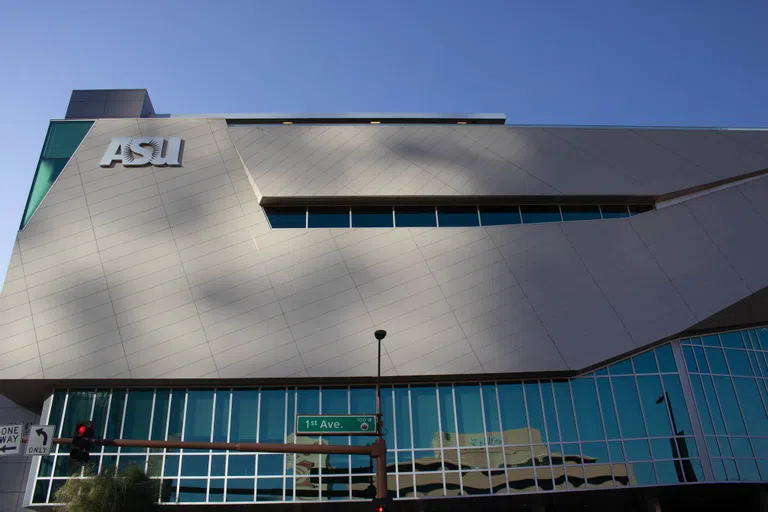 Glass and gray sided building with ASU logo in upper left corner