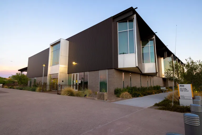 A dusk sky appears behind the ASU Prep Academy High School building.