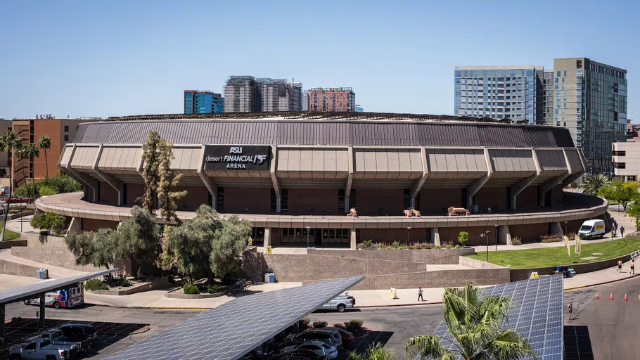 Aerial view of circular building with Desert Financial Arena sign on front of it.