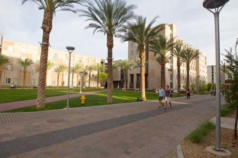 Students walking outside entrance to Barrett Academic Complex.