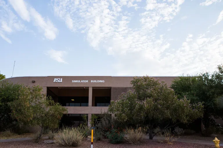 Trees in front of building labeled Simulator Building