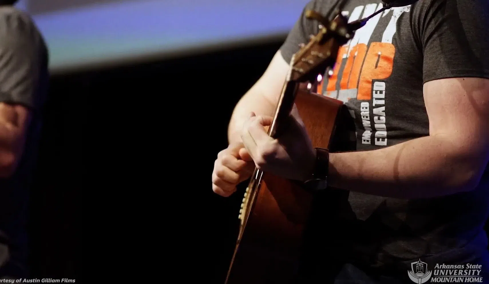 Close up of someone playing guitar