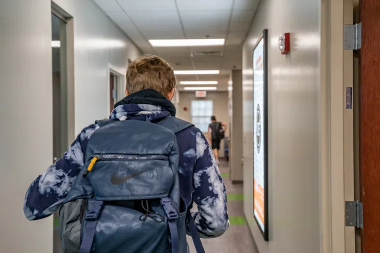 Student walking in the hallway 