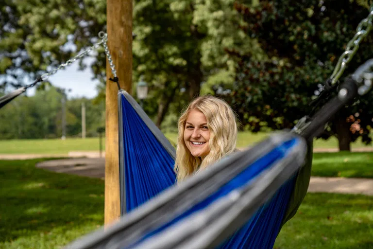 Student in hammock outside