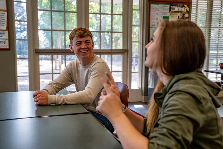 Students chat in Roller Hall