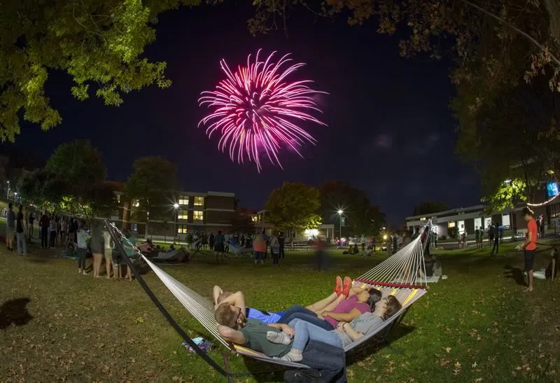 Students watching firework show together in Hinman College