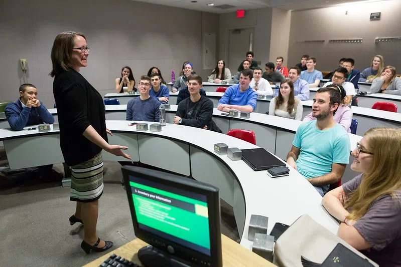  Visiting Assistant Professor at School of Management teaches a class at Academic Building A.