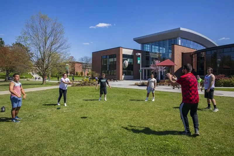 Students playing ball in the Peace Quad