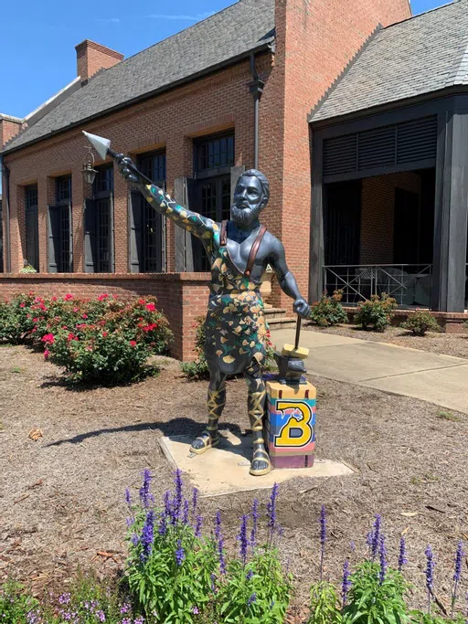 Small Vulcan statue replica in front of the admission building 