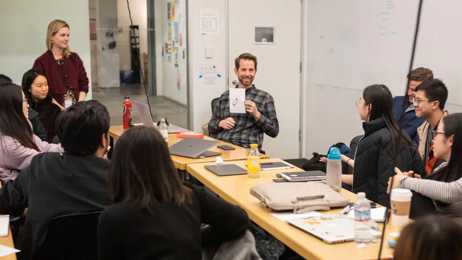 A group of students in a classroom explore topics related to cognitive science.