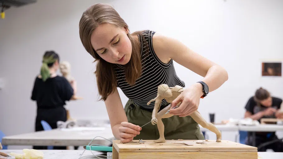 A student works on sculpting an object for an Animation class.