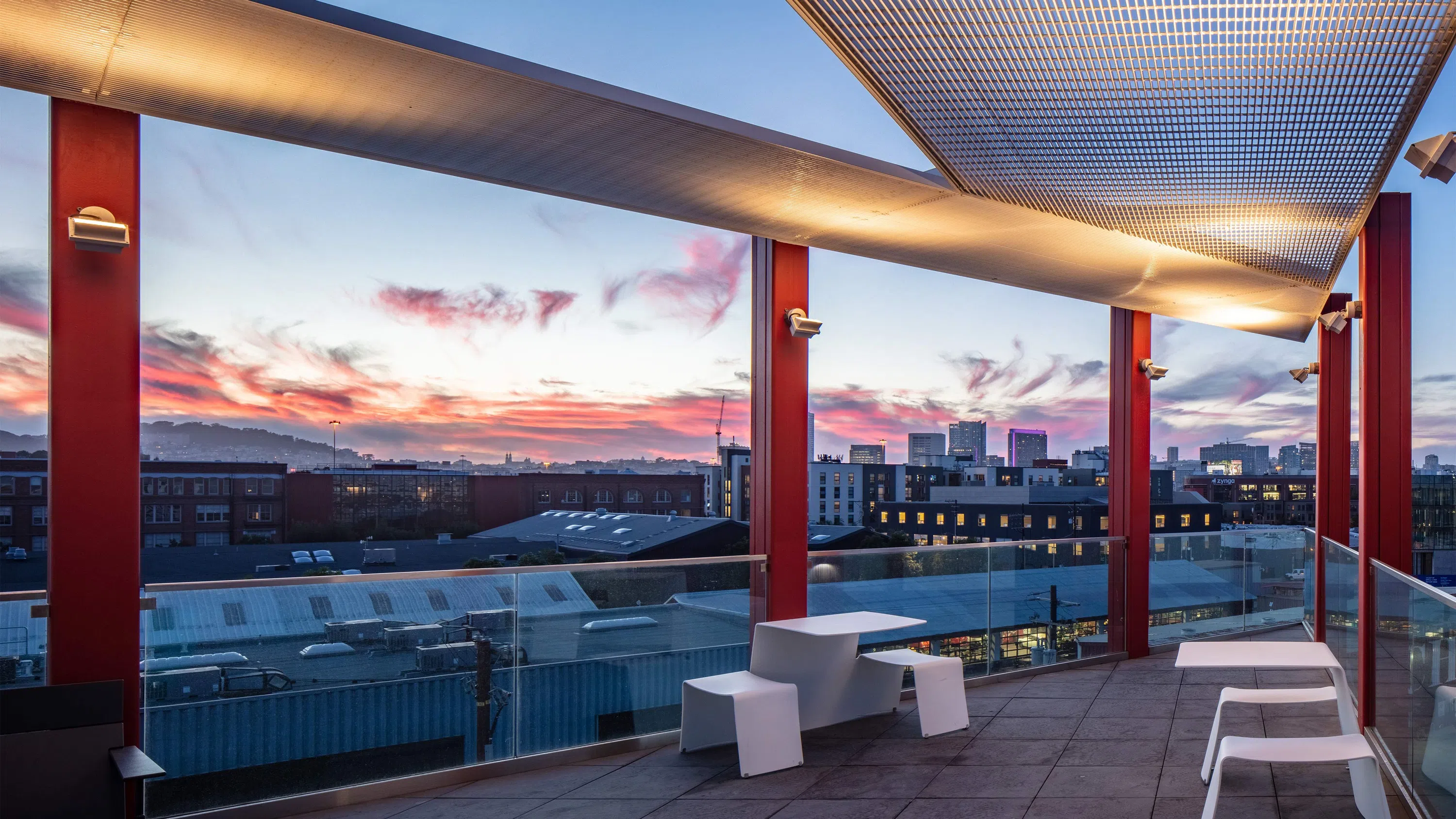 The terrace with a dramatic purple and orange sunset.