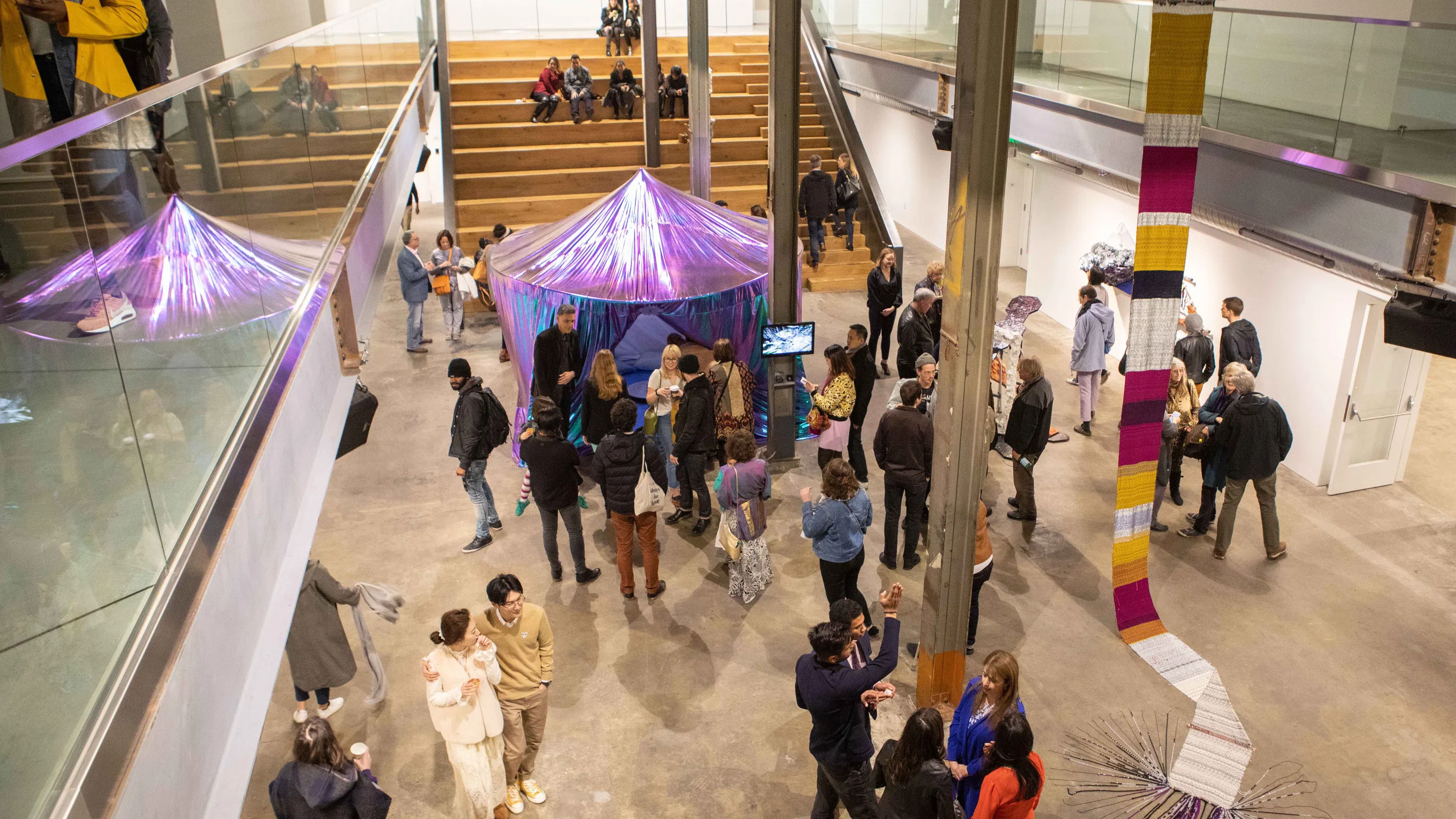 Bird’s eye view of art and people in the atrium of Minnesota Street Project.