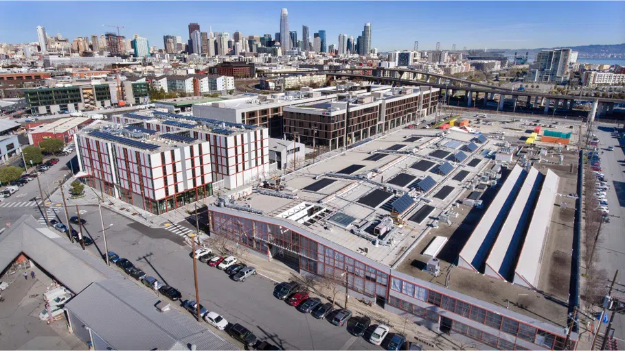 Drone photography overlooking CCA’s Main Building and residence hall, with the San Francisco skyline in the background.