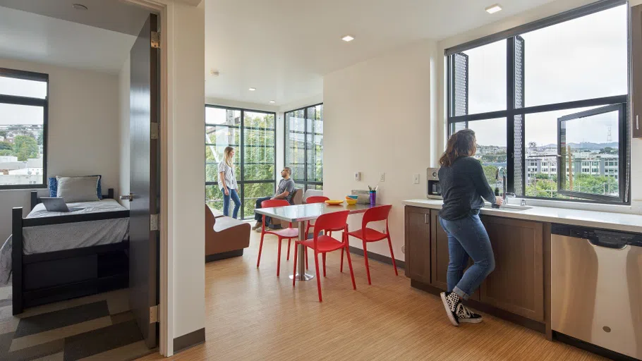 An interior view of one bedroom and the common area.