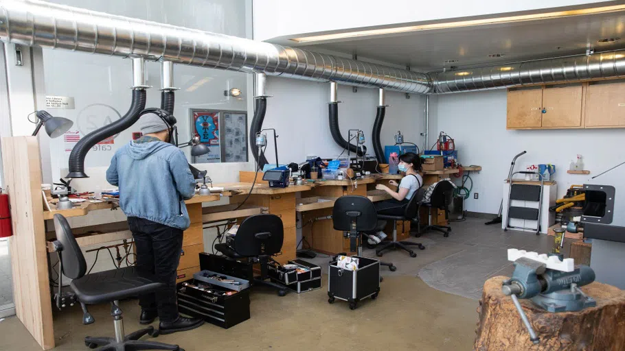 Two students working in the Jewelry and Metal Arts studio.