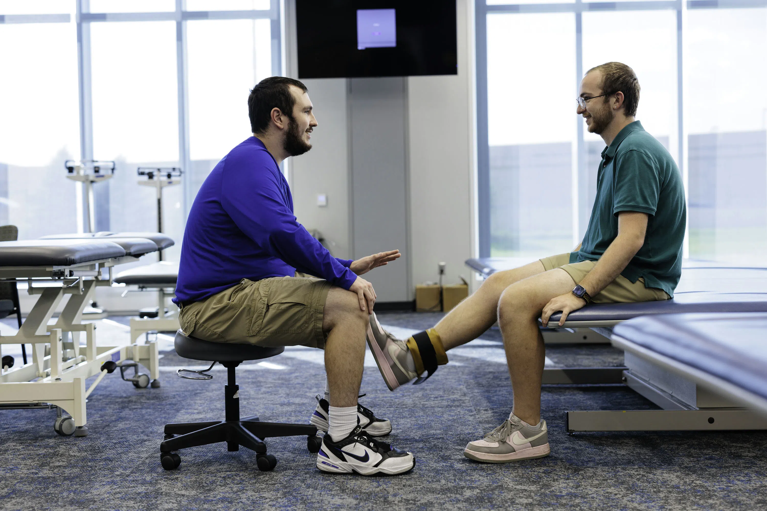 Physical therapy student practicing muscle manipulations