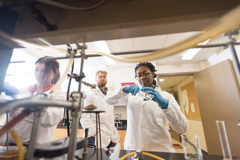 student working with a beaker