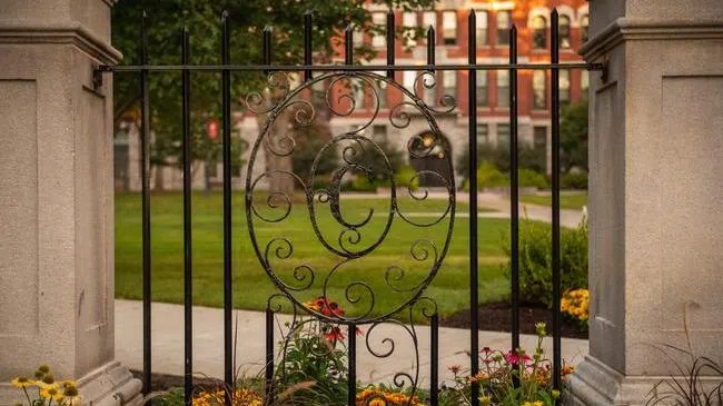 Iron gate with decorative letter "C"