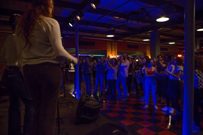 students dancing at rock concert