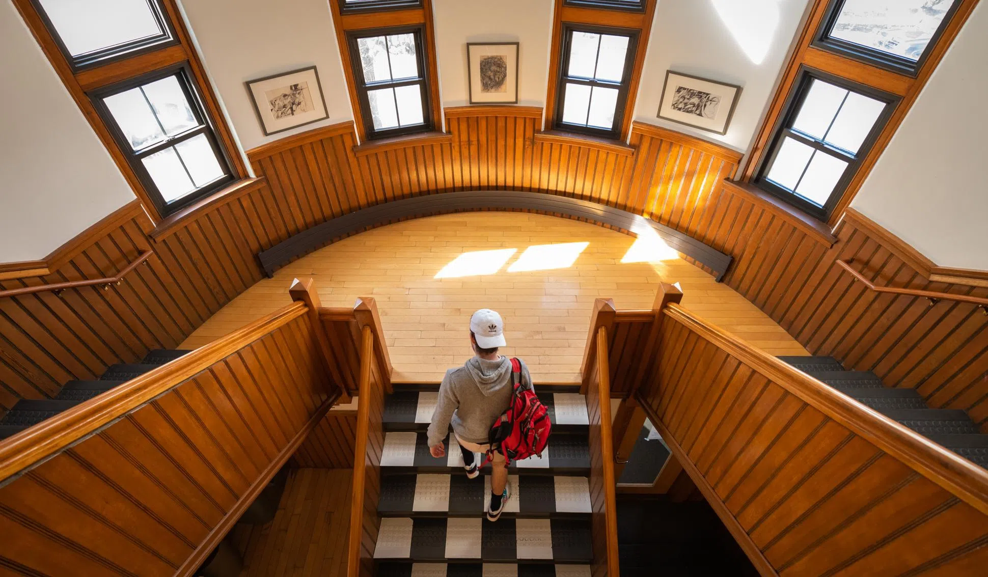 student walking up staircase