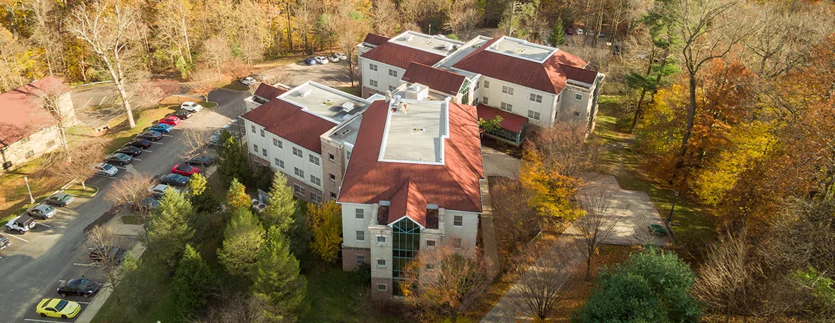 A sky view of buildings and a parking lot