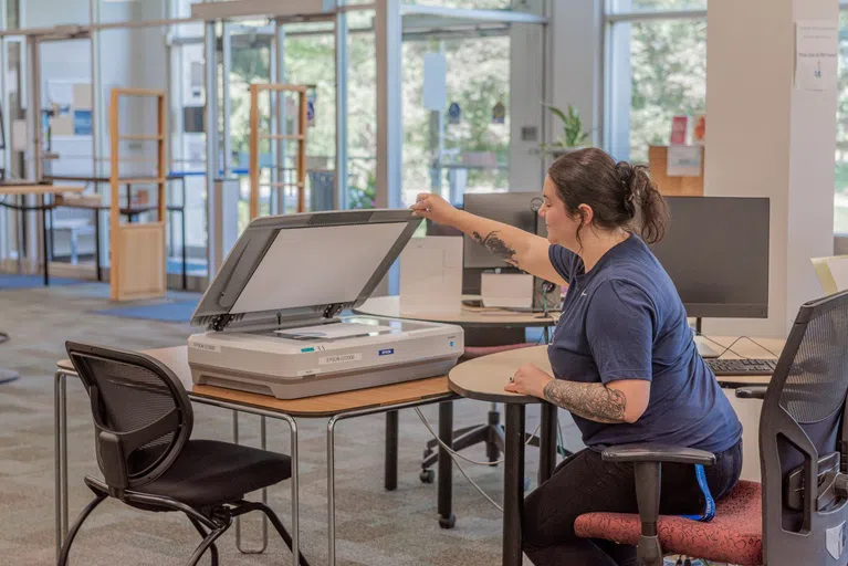 Student scanning paperwork 