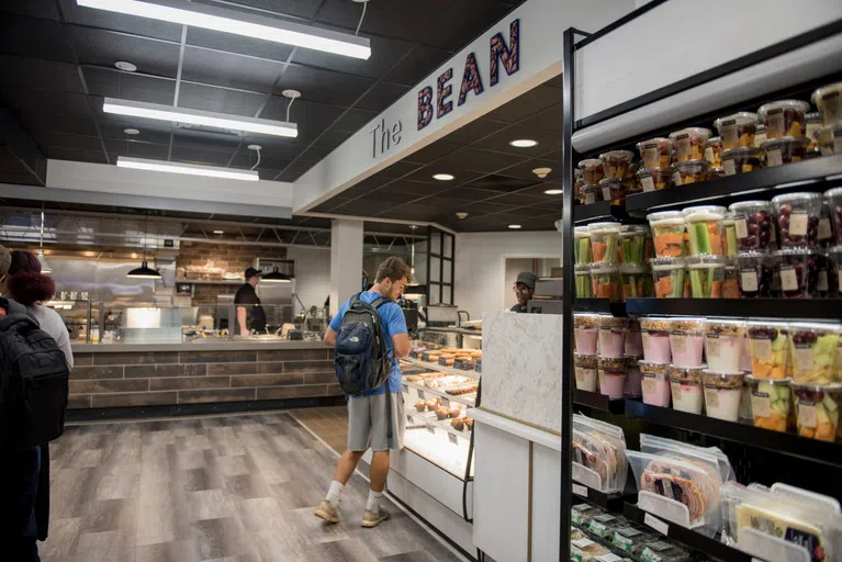 Student grabbing food in The Bean