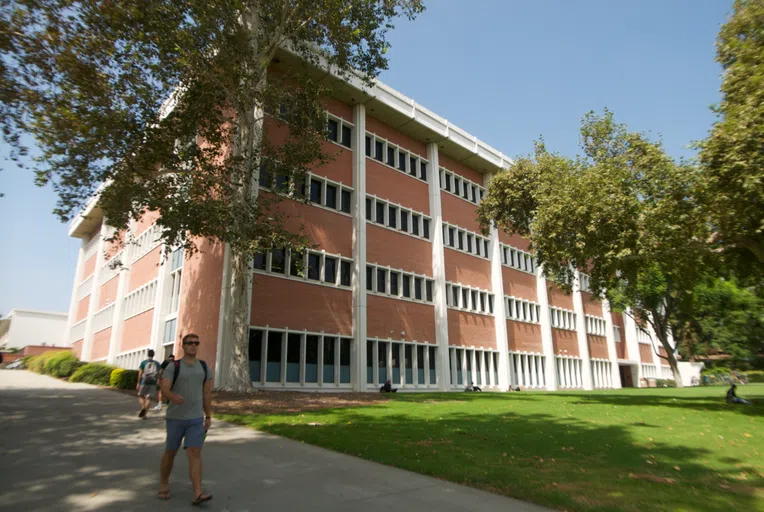 Student walking outside of the College of Science building