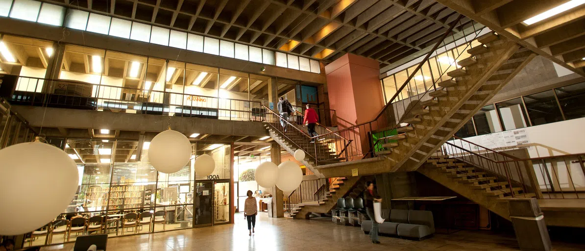 People walking around the inside of the Environmental Design building